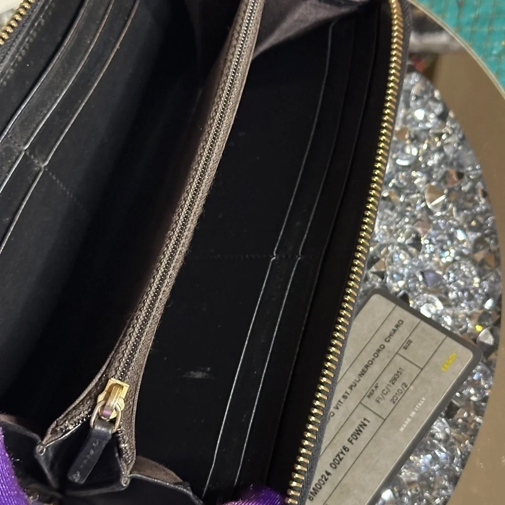 Vintage Fendi black patent leather zip-around continental wallet.